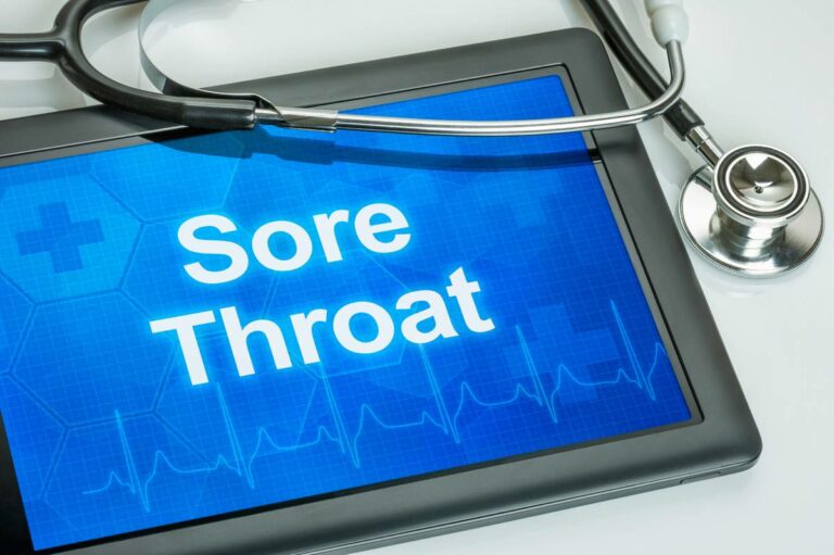 Ipad that says sore throat with stethoscope